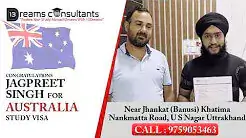 Jagpreet Singh holding his approved Australia study visa alongside a consultant at 13 Dreams Consultants, Khatima, Uttarakhand