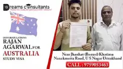 Rajan Agarwal proudly holding his approved Australia study visa with guidance from 13 Dreams Consultants, Khatima, Uttarakhand