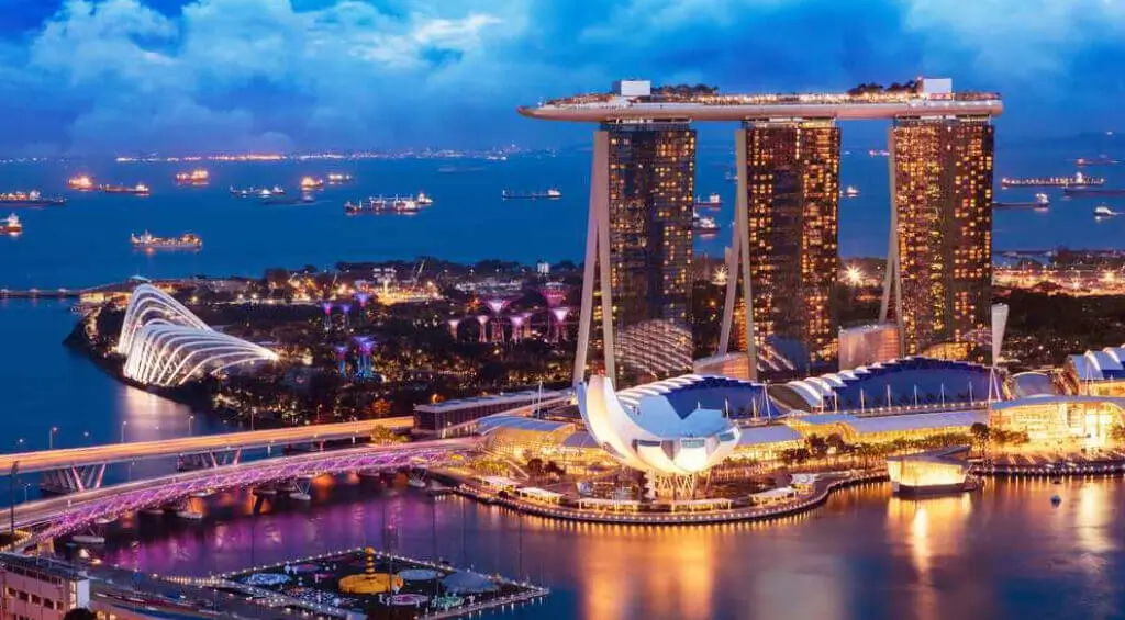Iconic Marina Bay Sands in Singapore at dusk with its unique ship-like rooftop and vibrant waterfront, ideal for students planning to study in Singapore.